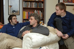 Hunter Weeks, Josh Caldwell, and j.fred watch a game during playoffs for their league.